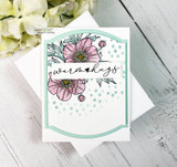 Soft white card with pink anemone blooms over mint polka dots and a 'warm hugs' sentiment banner.