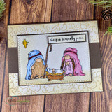 Card with the gnomes in blue and pink on a cream swirl-embossed panel with a small gold star and the sleep in heavenly peace label.