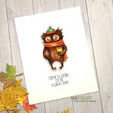 Clean white card with autumn leaves: the owl colored in warm browns and orange holding a mug over the great-day sentiment.