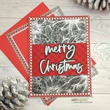 Card using the Heart of Christmas dies. Die-cut 'merry Christmas' on a white pine background with a red frame.