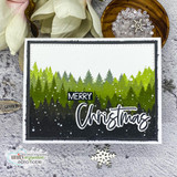 Card using the Heart of Christmas dies — 'MERRY Christmas' over a green pine-forest scene.