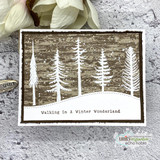 Winter Wonderland Walk card, the pine forest scene colored against a bright sky, 'Walking In A Winter Wonderland' sentiment.