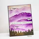 Card with a purple mountain sunset and pines, 'may this year be full of beautiful blessings.'