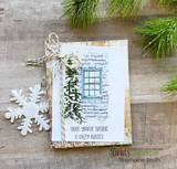 Clean card with the window and snowy pine on white brick, 'Hope you're having a cozy winter.'
