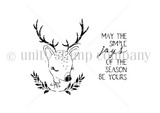 Line-art red rubber Itty Bitty stamp of a deer with a leafy wreath and "May the simple joys of the season be yours."