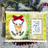 Card of the deer in an oval frame with a red bow and "May the simple joys of the season be yours."