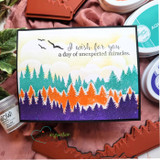 Sunset forest card in teal and orange pines with 'I wish for you a day of unexpected miracles.'