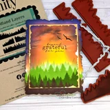 Card sample. A sunset orange-and-green forest, 'beary grateful for you.'