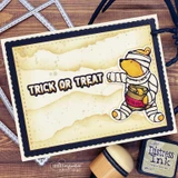 Card sample. A mummy bear on an aged mountain background, 'trick or treat.'