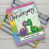 Rainbow polka-dot card with the dino couple — you make my heart saur