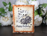 Sepia collaged clock face on a dotted panel with an orange plaid mat, tied with twine, sentiment 'Happy Birthday, you are timeless'