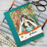 Card with the girl over an autumn wood-plank panel and 'get well soon.'