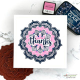 Square card of a navy and pink mandala, 'thanks.'