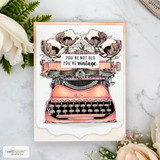 Peach layered card with white roses beside it, a coral pink typewriter topped with cream poppies, and a die cut label with a you're not old you're vintage greeting.