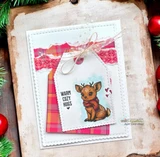 A nesting-die frame around a reindeer on a plaid card, 'warm cozy hugs.'
