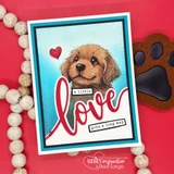 A nesting-die frame around a puppy on a red card, 'a little love goes a long way.'