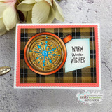 Card with buffalo-check background framing a hot-cocoa mug and 'Warm Winter Wishes.'