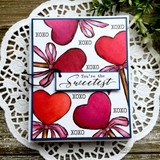 Several red and pink heart lollipops on a doily-framed card, captioned 'XOXO' and 'You're the Sweetest.'
