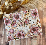 Card of the magnolia background colored soft pink over stitched papers.