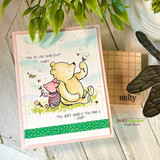 Soft watercolor scene of Pooh and Piglet in the grass with both love sentiments on a pink-framed card.