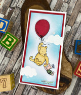 Tall red-framed card of Pooh on a red balloon over stamped clouds with alphabet blocks around it.