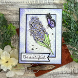 Card of a purple lilac with a butterfly on a soft patterned panel, 'be your own kind of Beautiful'.