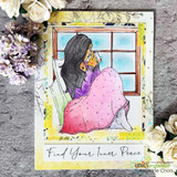 Handmade card featuring the AngieGirl curled at a window in a cozy blanket, in a lavender blanket with florals, stamped with 'Just a note thinking of you'.