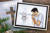 Card with the praying man beside a wooden cross and 'when life gives you more than you can stand, kneel.'