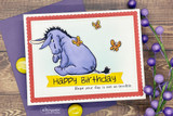 Red-scalloped Happy Birthday card of Eeyore watching two orange butterflies.