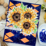 Bright sunflowers fussy-cut and layered over a deep navy geometric background with orange diamond accents.
