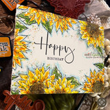 Sunflower corners frame a cream card with a hand-lettered 'Happy Birthday' shown on the sample.