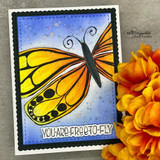 Card with the butterfly in gold on a blue starry background and 'You are free to fly.'