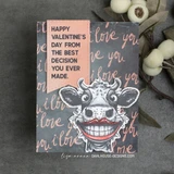 Card sample — a grinning cow on 'i love you' script paper, 'Happy Valentine's Day from the best decision you ever made.'