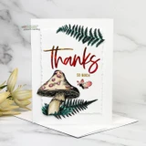 Card with a red toadstool mushroom and green ferns and the sentiment 'thanks so much.'
