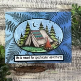 Card of a camping tent and fir trees under a night sky with the banner 'life is meant for spectacular adventures.'