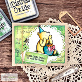 Card with party-hat Pooh and his honey pot on a doily: 'Sweet little smiles on your birthday.'