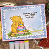 Card with Pooh holding a pastel egg in a blue frame: 'Thinking of your sweet face everyday.'