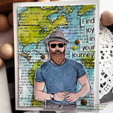 Card with the map and text background washed in teal and yellow, a bearded man in sunglasses and a grey hat stamped and colored, and white word tiles spelling out a journey greeting.