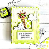 Handmade card featuring the trio of tall giraffes with fluffy clouds, with a green stitched frame, stamped with 'Life would be boring without you, friend'.