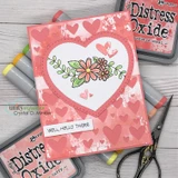 Card featuring a die-cut Dashes and Frills scalloped heart frame around a coral floral panel.