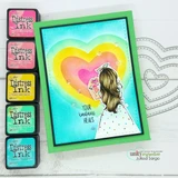 Rainbow-heart card built with a Dashes and Frills die-cut heart frame.