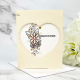 Delicate daisy swag around a heart die-cut, 'Congratulations,' on cream.