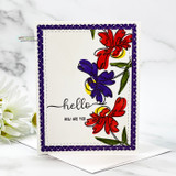 White panel with red and purple daisies stamped in a scattered cluster inside a deep purple scalloped frame, hello how are you across the middle.