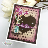 Distressed pink and cream card with a dark brown heart panel, a colored daisy in a teal vase and a purple hello die cut across it.