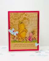 Pink doily-stenciled card with the pair among hearts and the 'difficult days' quote.