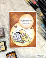 Spotlight-sponged card of Pooh, Piglet and Eeyore snuggling with the called-love quote.