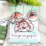 Card with soft peach poppies over a mint blended sky and a script sentiment reading To me, you are perfect, styled with green baker's twine.
