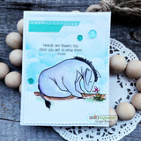 Eeyore on a blue-sky card with wood beads, 'weeds are flowers too'.