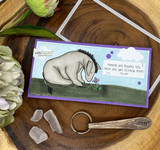 Eeyore on a slimline card with green grass, 'weeds are flowers too'.