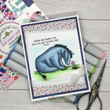 Eeyore on a colorful floral-print card, 'weeds are flowers too, once you get to know them'.